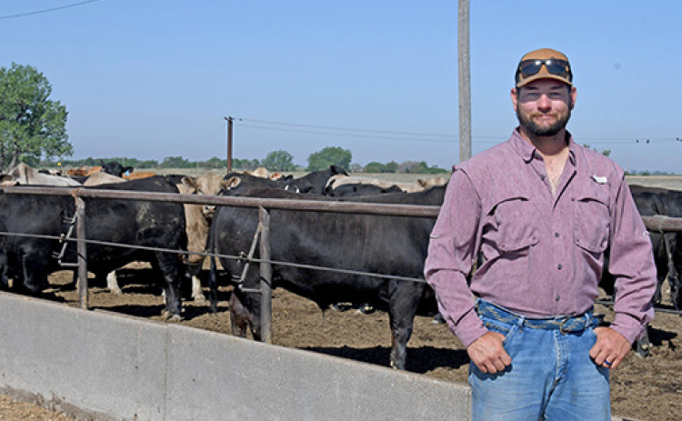 Local feedlot owner Preston Franzen stands near the feeding bunk of a pen of feeder calves at his Franzen Feeders yards near Stockham. As a former Western Nebraska ranch kid and now the president of the York-Hamilton County Cattlemen, he loves to talk about the challenges, opportunities and future of the beef industry.