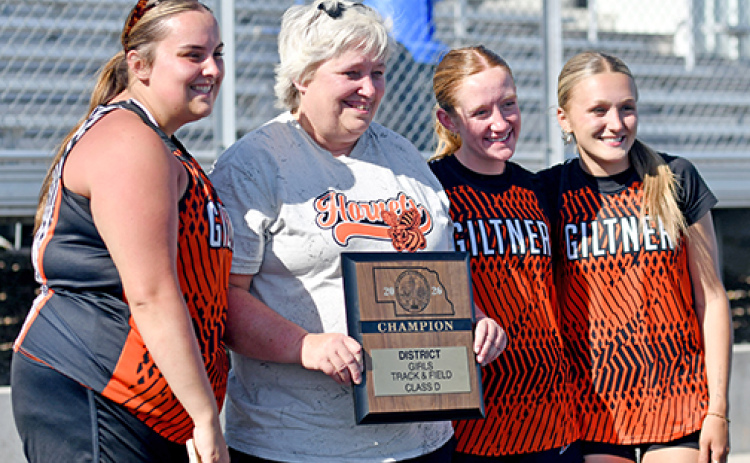 For the first time since its dominant title run a few years back, Giltner’s girls track team won the D-6 district championship in Kenesaw May 13. Posing with coach Nancy Lockmon and the championship trophy are seniors Kailyn Wilson (far left), Avery Reeson and Gracie Kreutz.