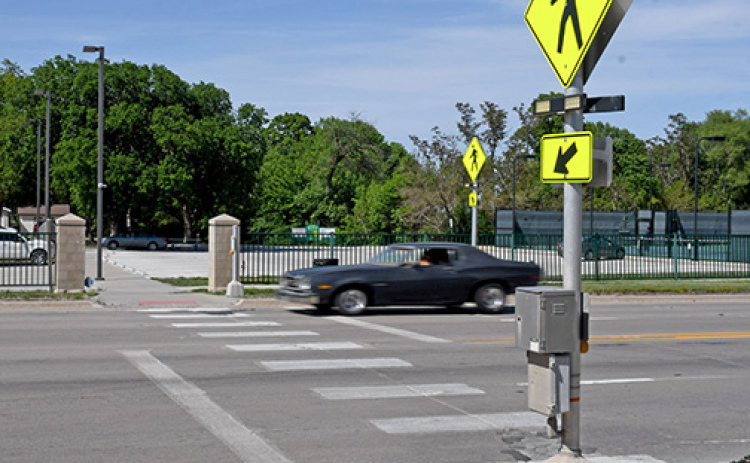 With the speed limit set at 35 mph on that stretch of Highway 34, Aurora Police Chief Paul Graham urges children and adults crossing the highway on the way to the Aurora Aquatic Center this summer to use caution and cross wisely. He offered similar advice to drivers, saying that if the yellow caution lights are flashing and a pedestrian is waiting to cross, it is a traffic violation to proceed through the crossing.
