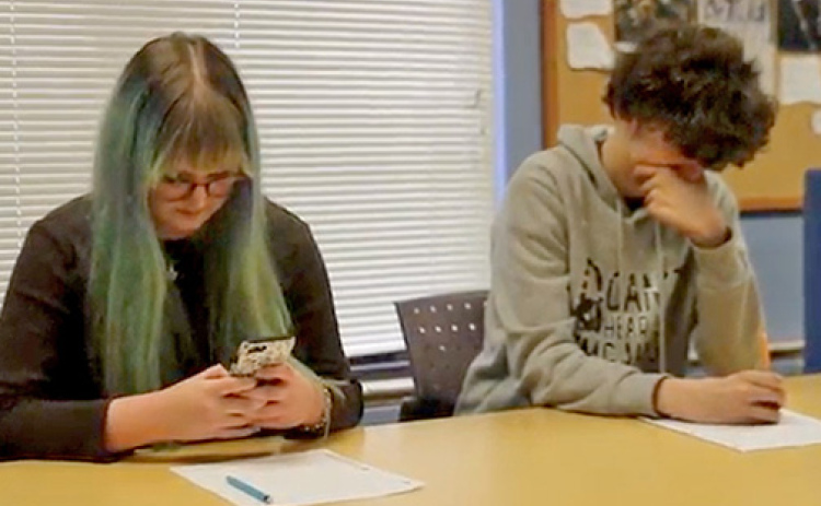 Senior Scott Bennett (not pictured) placed second for both his narrative film “Nora, Winona, and the Anomaly” and his PSA film “Your Choice” at the Nebraska video championships. Pictured at left in this screenshot from “Your Choice” is Bennett’s friend Araya Johnson who starred in the film and was one of two people named Best Actress at the video championships.