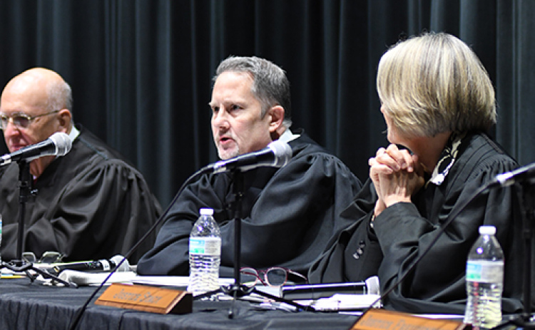 Jeff Funk, center, chief justice of the Nebraska Supreme Court, speaks in a Q&A session during last week’s Law Day at Aurora High School.