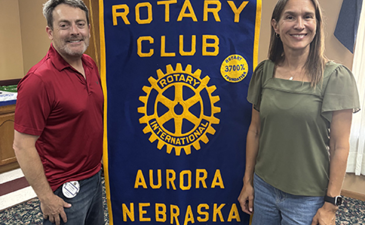 Jen Ramaekers, co-founder of Fig Tree & Vine, presented an update on a school construction project in Uganda to the Aurora Rotary Club. Pictured at left is Jeff Morris, president of the local club.
