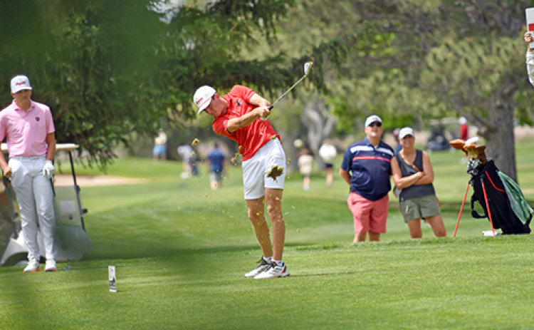 Ryan Staehr takes a chunky divot off the par-3 17th hole during Thursday’s second round of the Class B state golf tournament at Scottsbluff Country Club. Staehr turned in rounds of 86 and 88 for a two-day score of 174.