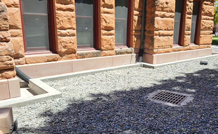 The sandstone base blocks along the west side of the Hamilton County Courthouse have been replaced with new ones cut from the same Colorado quarry.