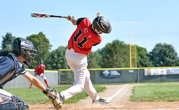 Jack Carstensen connects with one down the left field line duirng a game earlier this season for the Aurora Cooperative Juniors team.