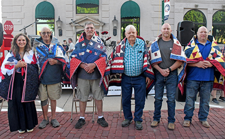 The six veterans recognized at a Quilts of Valor ceremony during A’ROR’N Days Friday night were from left: Amy Lou Emaneul-Bassett, Paul G. Duey, Richard Hock, Bruce Nilson, Jason Trumble and Jeff Trumble.