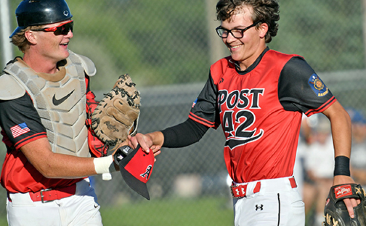 ukas Fry (right) and Dylan Ronnau share a laugh coming off the field during a game earlier this season. Fry has pitched 18 innings this season for the Pinnacle Bank Seniors, the most on the team.