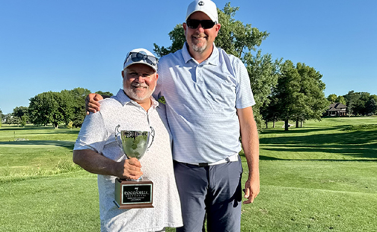 Phil Fendt, left, and Lucas Wood won top honors as championship bracket winners at this year’s Member/Guest Tournament at Poco Creek Golf Course.