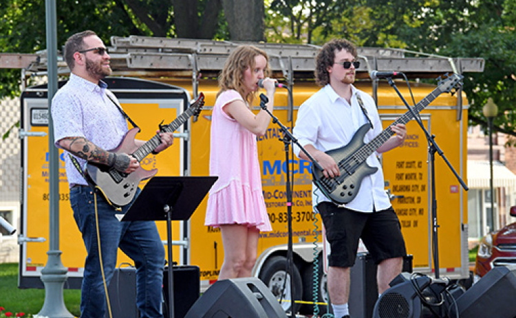 The 2026 season of Bands on the Bricks concluded Friday night with a performance by Maddog and the Bone Fetchers. Pictured from left: Carlos Vargas, Maddy “Maddog” Baker and Taygun Rothchild.