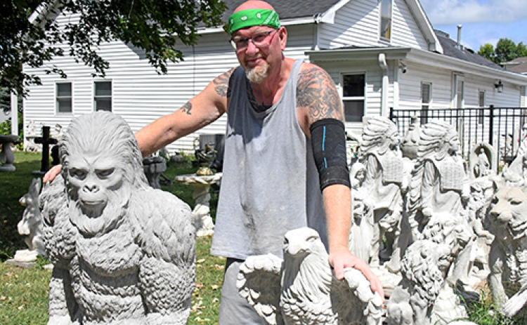Carl Franklin is the owner and artist at Moonlight Statuary in Aurora, displaying hundreds of concrete statues in his yard, driveway and around his home at 604 K St..