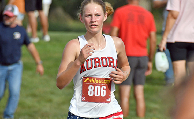 Kailey Dick ran her first race of the season at the Aurora Invite with renewed strength an a finish of 18th with a time of 22:36. Aurora runners wore American Flag shorts in celebration of America 250 and in remembrance for the 25th anniversary of 9/11.