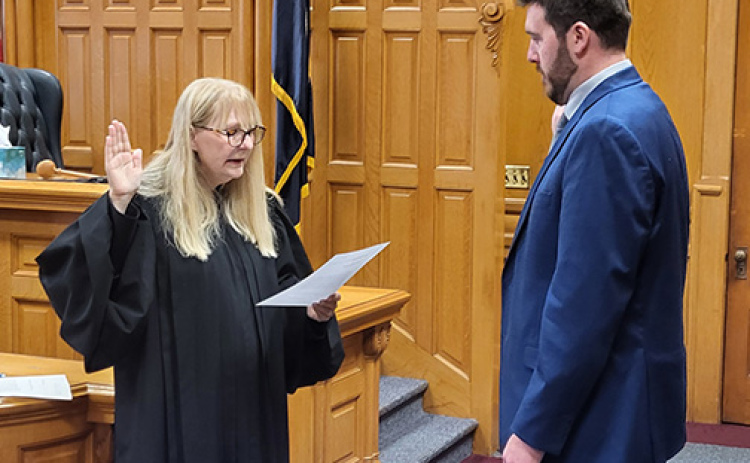 New Hamilton County Attorney Nathan Heinz of York is sworn in Thursday morning by District Judge Rachael Daughterty. In remarks after the swearing in, the judge noted that Heinz’s first hearing as a defense attorney had taken place before her in that very same courtroom.