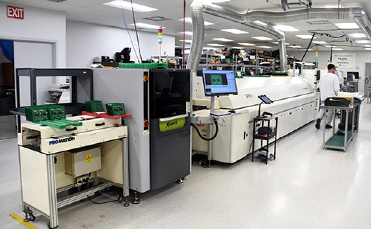 This photo shows some of the new equipment purchased recently at Aurora Boardworks, which uses high-resolution cameras to inspect circuit boards at different stages of production.