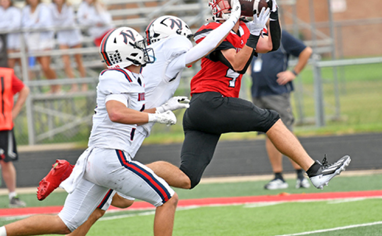 Aurora senior Kash Kleinschmidt hauled in two touchdown catches as the Huskies downed Norris 30-21 Saturday afternoon. The game was postponed from Friday night to Saturday afternoon after rain and lightning continued throughout the night hours Friday.