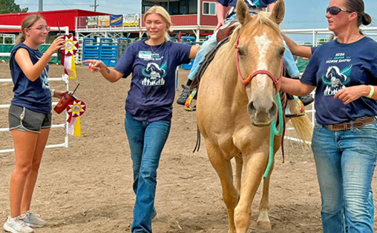 Brooks Borrell was one of the 29 riders who participated in the first Adaptive Horse Show at the State Fair. He is shown here riding the horse, Peaches. Pictured with Borrell, from left, are Bria Schaeffer, Anna Hanquist and Cortney Brades.