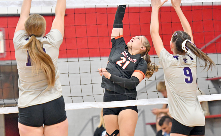 Chloe Consbruck splits two Axtell defenders during Giltner's win over the Wildcats Tuesday.