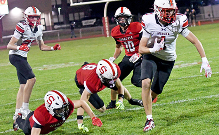 Landon Danhauer eludes multiple Scottsbluff defenders, scoring the game’s first touchdown in Aurora’s 24-21 loss to the Bearcats Friday. Danhauer caught two touchdowns in the game, totaling 77 yards.