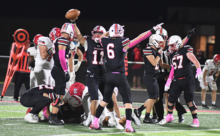 Malaikai Camacho holds up the ball after recovering a third-quarter Bison fumble, leading to a 34-7 win. The Huskies finished plus-five in turnover margin during the 2026 regular season.