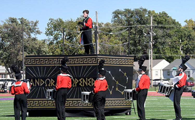 Many spectators were drawn by the visuals as much as Pandora’s Box as Aurora performed at Harvest of Harmony. That afternoon, the band took home its first superior of the season in the Class B field show. Pictured performing in the field show are from left: Ashlyn Yockey, Kinslea Johnson, Landrie Champion and Lucy Johnson.
