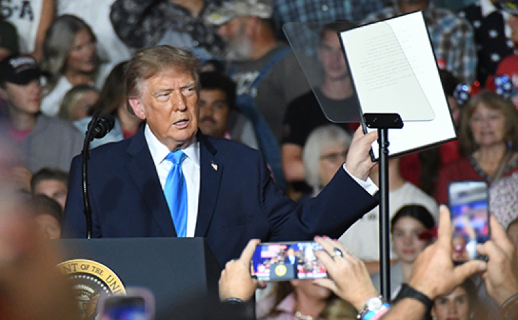 President Trump holds up an executive order temporarily removing the off-road requirement for the use of red dyed diesel. The order allows the use of the tax free fuel to be used on roads and highways through the end of the year.