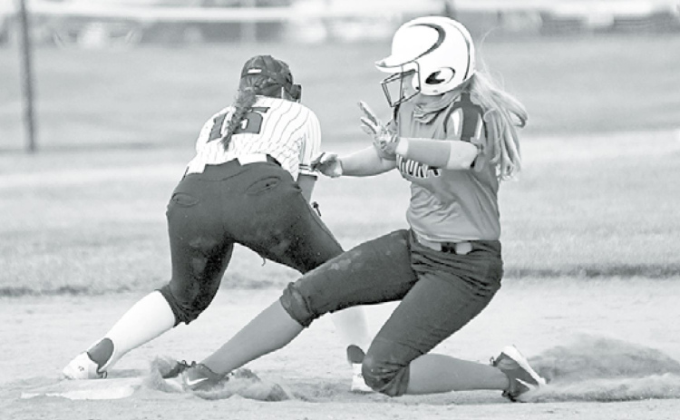 Above: Lauryn Thomas slides safely into second base following a base hit. At right, Rylee Olsen had a three-run homer and pitched a one-hit shutout in a 17-0 win at Centennial. News-Register/Richard Rhoden
