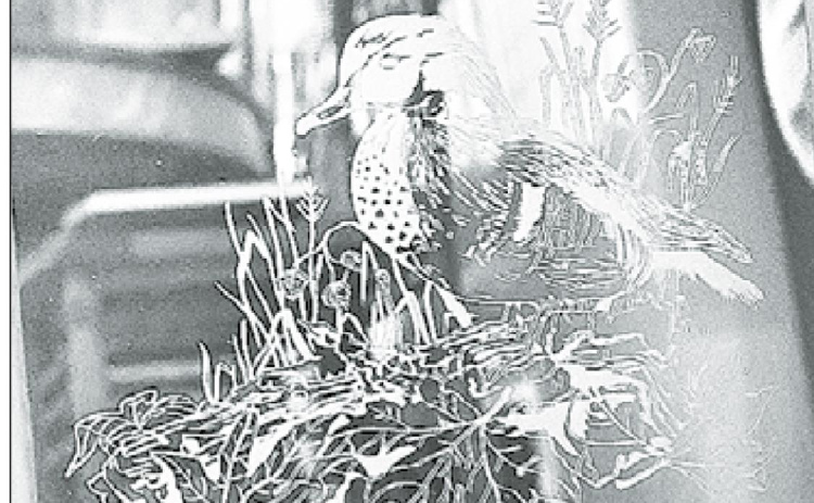 An etching of a woodland duck created for Larry Robert’s father showcases the details in each of his pieces. News-Register/Jeni Moellenberndt