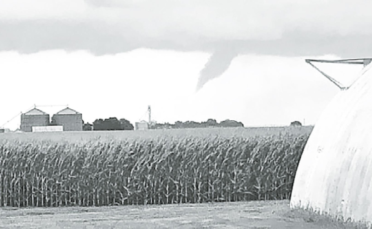 A funnel cloud forming near Hampton was photographed by Tessa Glinsmann. Her family’s acreage suffered damages from the Friday night storm. Courtesy photo