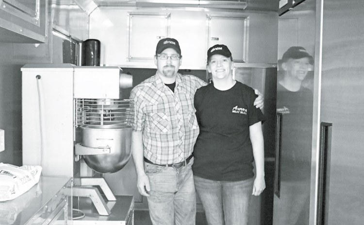 Andrea Winfield, who purchased the Aurora Meat Block with her husband Brent in 2014, is now launching a new culinary business based out of this new 8 1/2x20 foot food trailer. News-Register/Cheyenne Rowe