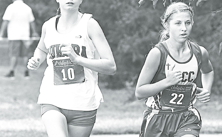 Elena Kuehner works to take and hold the first-place position during the GINW Invite. She was able to keep the lead for over half of the race. News-Register/Jeni Moellenberndt