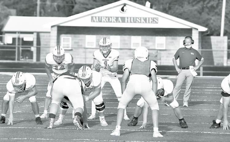 Aurora coach Kyle Peterson was on the field for part of Friday’s soap scrimmage, getting one final look at his team to help determine starting lineups for Friday’s season opener against North Platte. News-Register/Kurt Johnson