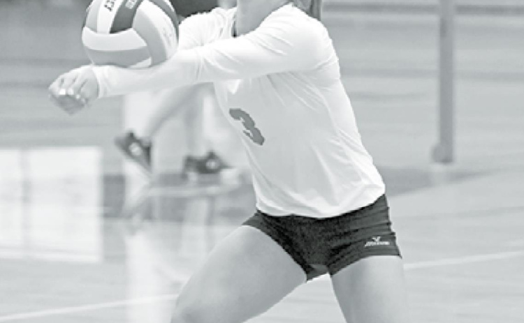 Cassidy Knust wears a mask during volleyball practice last week, something the team, led by the seniors, decided to do. News-Register/Richard Rhoden