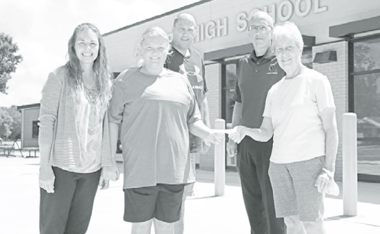 It was a special occasion as recent Husky grad Jessica Wert received a scholarship from the Aurora Alumni Association. Those present for the check presentation were, from left: Christy Wert, Jessica Wert, Jeff Wert, Aurora High School Principal Doug Kittle and Sandy Howland of the Aurora Alumni Association. News-Register/Cheyenne Rowe