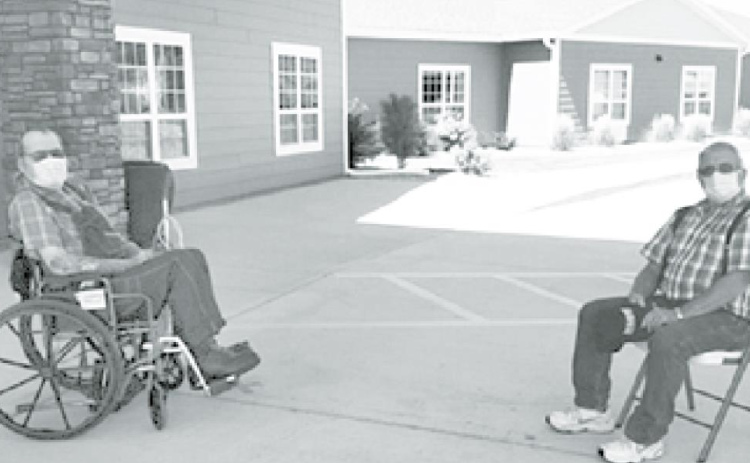 Westfield resident Marion Dittmer, left, visits outside in front of the facility with his brother, Larry. Family visits were just recently allowed at Westfield Courtesy photo
