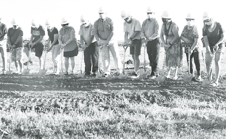Members of the Aurora United Methodist Church broke ground Sunday on a $2.2 million expansion project, which will include four new classrooms, a new kitchen, large activity space, storage and other amenities. News-Register/Kurt Johnson