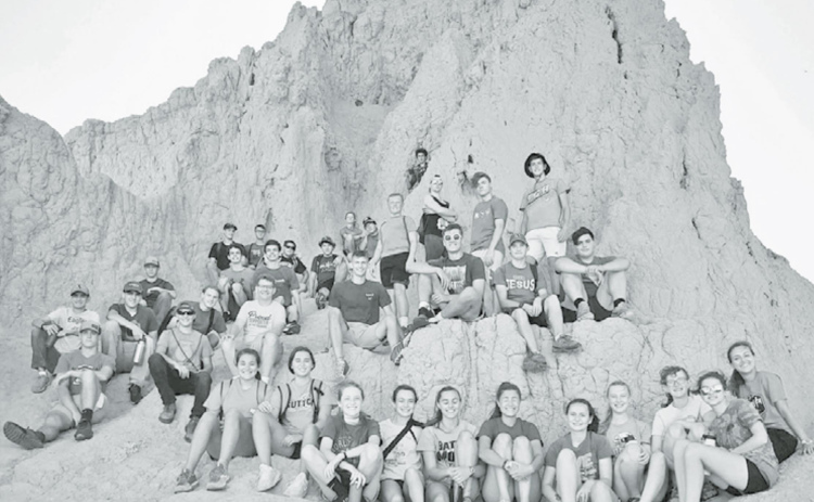 At left: This year’s CRC travel camp brought youth to South Dakota for a shortened seven-day getaway. Campers were without cell phones and spent time growing in faith. Below: Due to COVID-19, the trip had to be moved to South Dakota, but luckily campers were a ways from others on site and still enjoyed all nature had to offer as well as teachings led by adult leaders. Courtesy photos